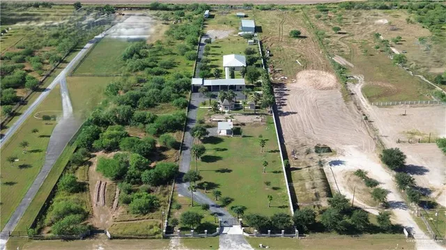 an aerial view of a residential apartment building with a yard