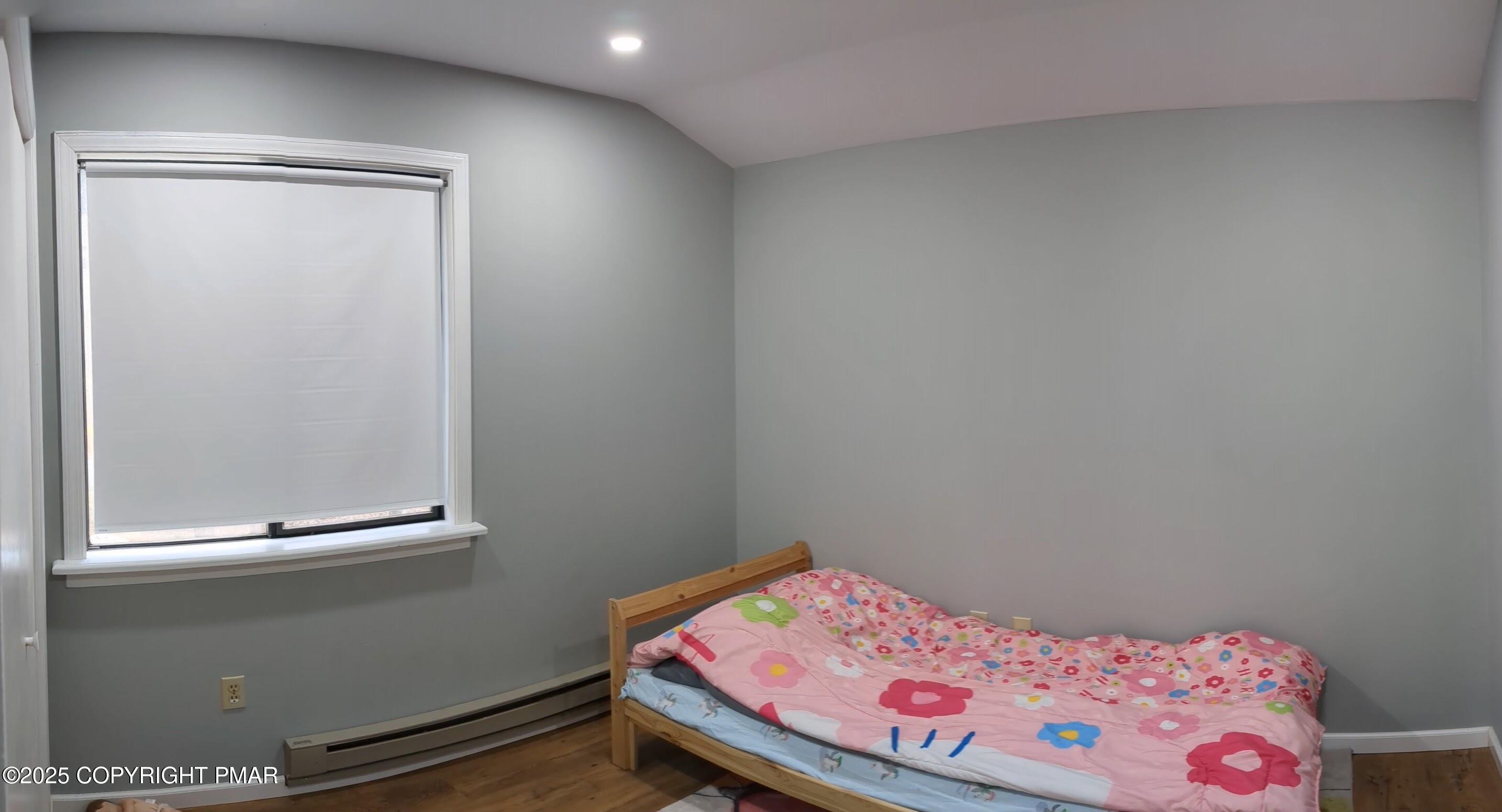 1027 Valley Road Newfoundland, PA 18445 - Photo 19 of 28 a bedroom with a bed and a window