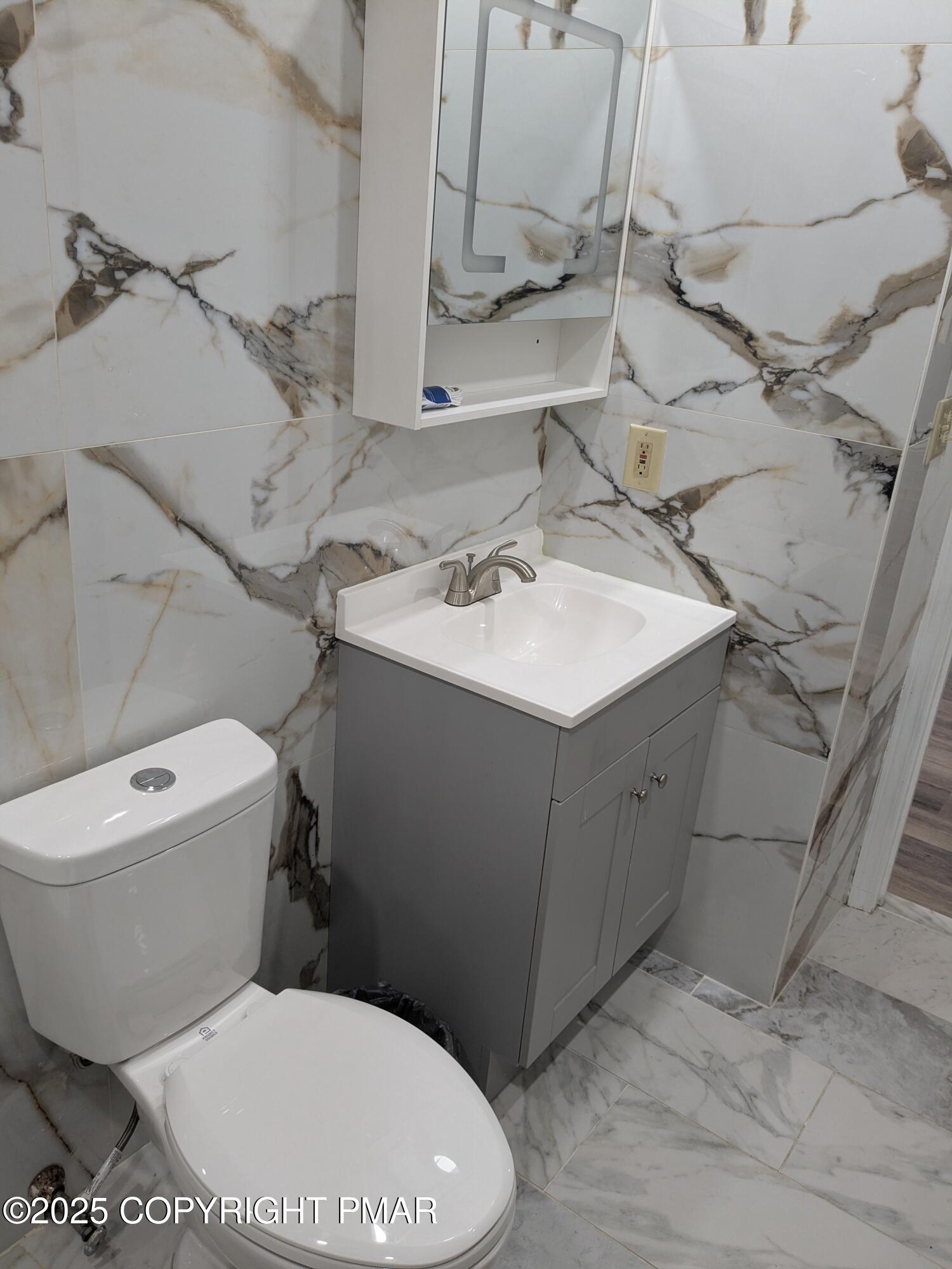 1027 Valley Road Newfoundland, PA 18445 - Photo 20 of 28 a white toilet sitting next to a bathroom sink