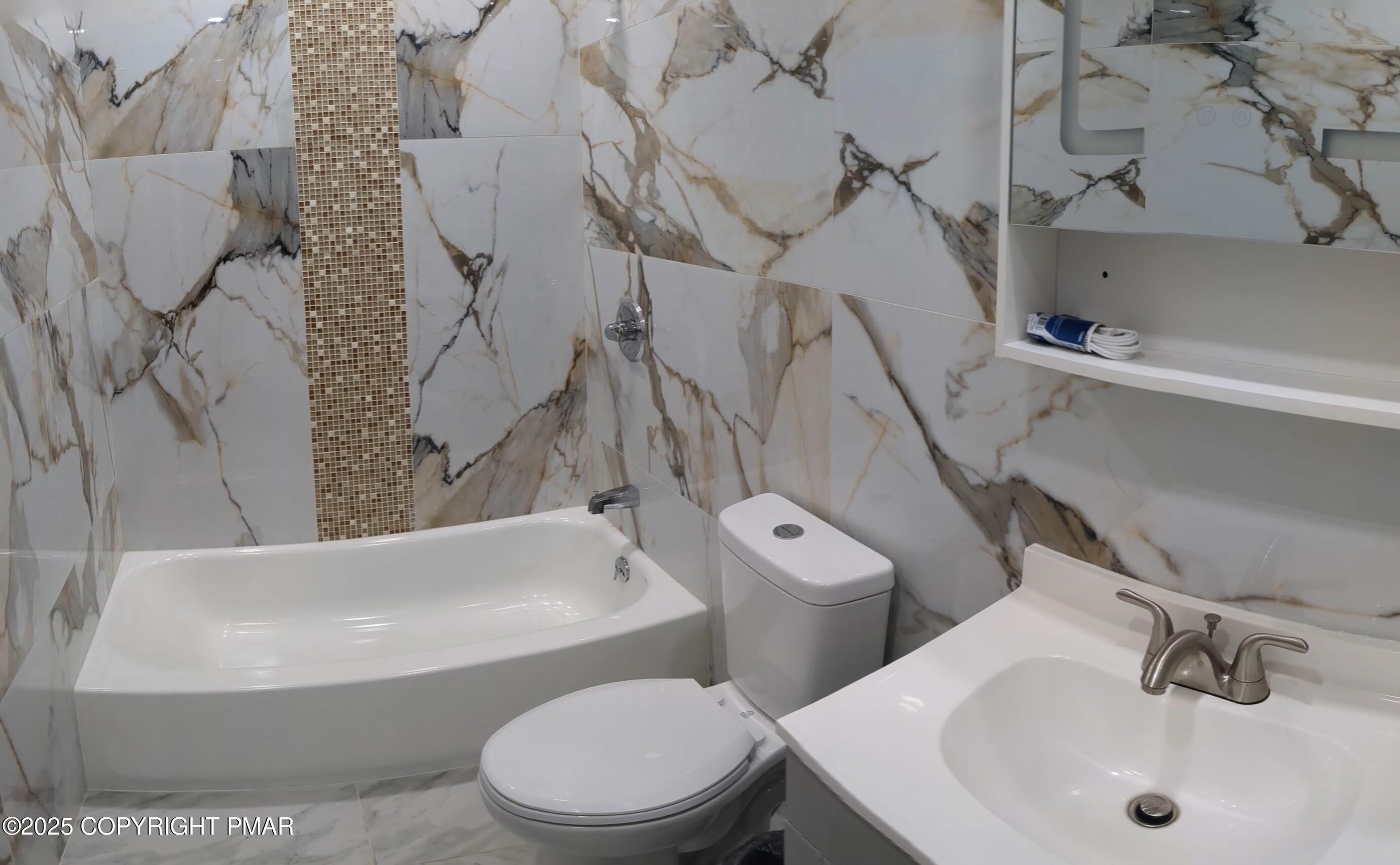 1027 Valley Road Newfoundland, PA 18445 - Photo 21 of 28 a white toilet sitting next to a bath tub