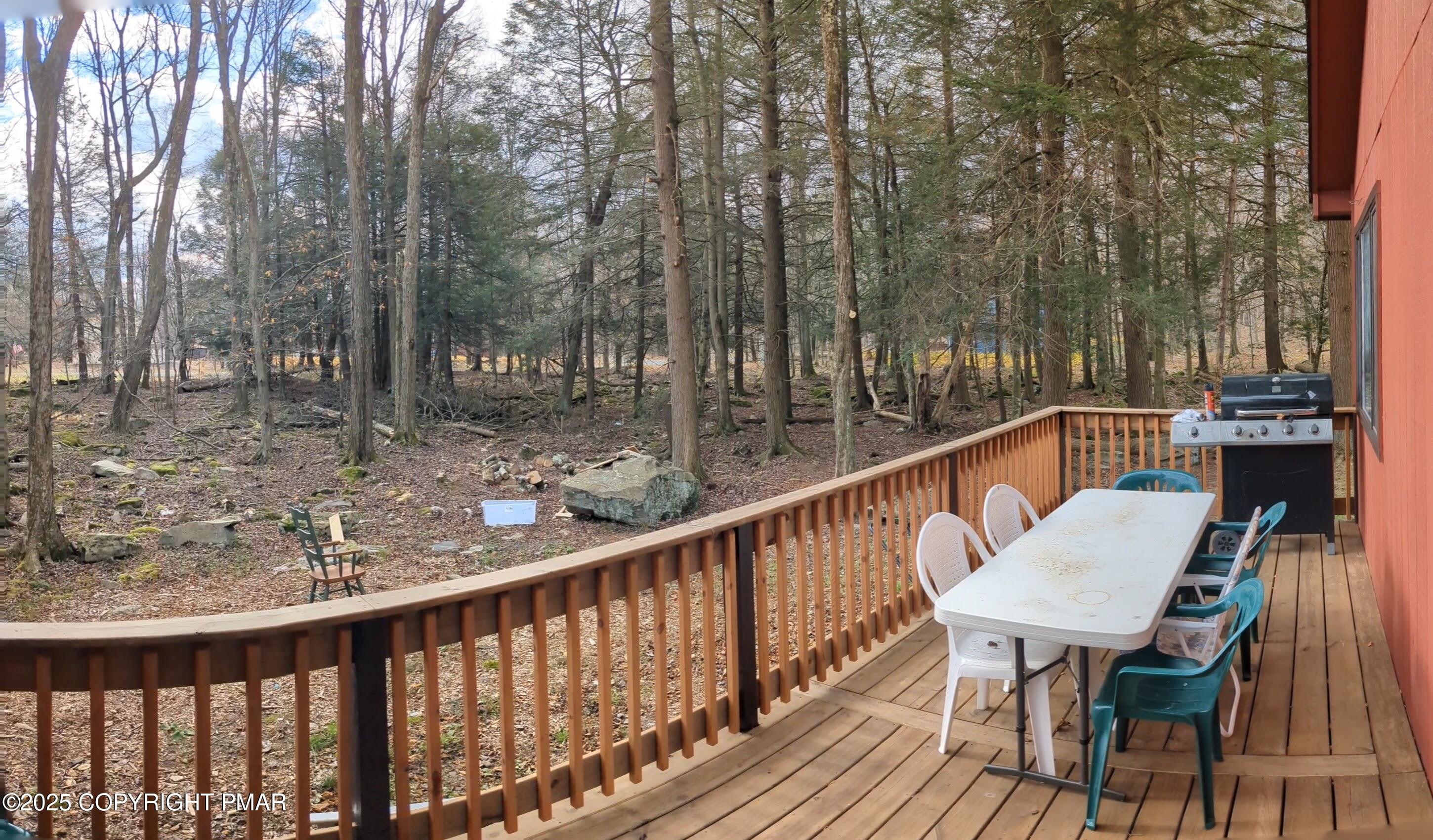 1027 Valley Road Newfoundland, PA 18445 - Photo 23 of 28 a view of a chairs and table on the deck