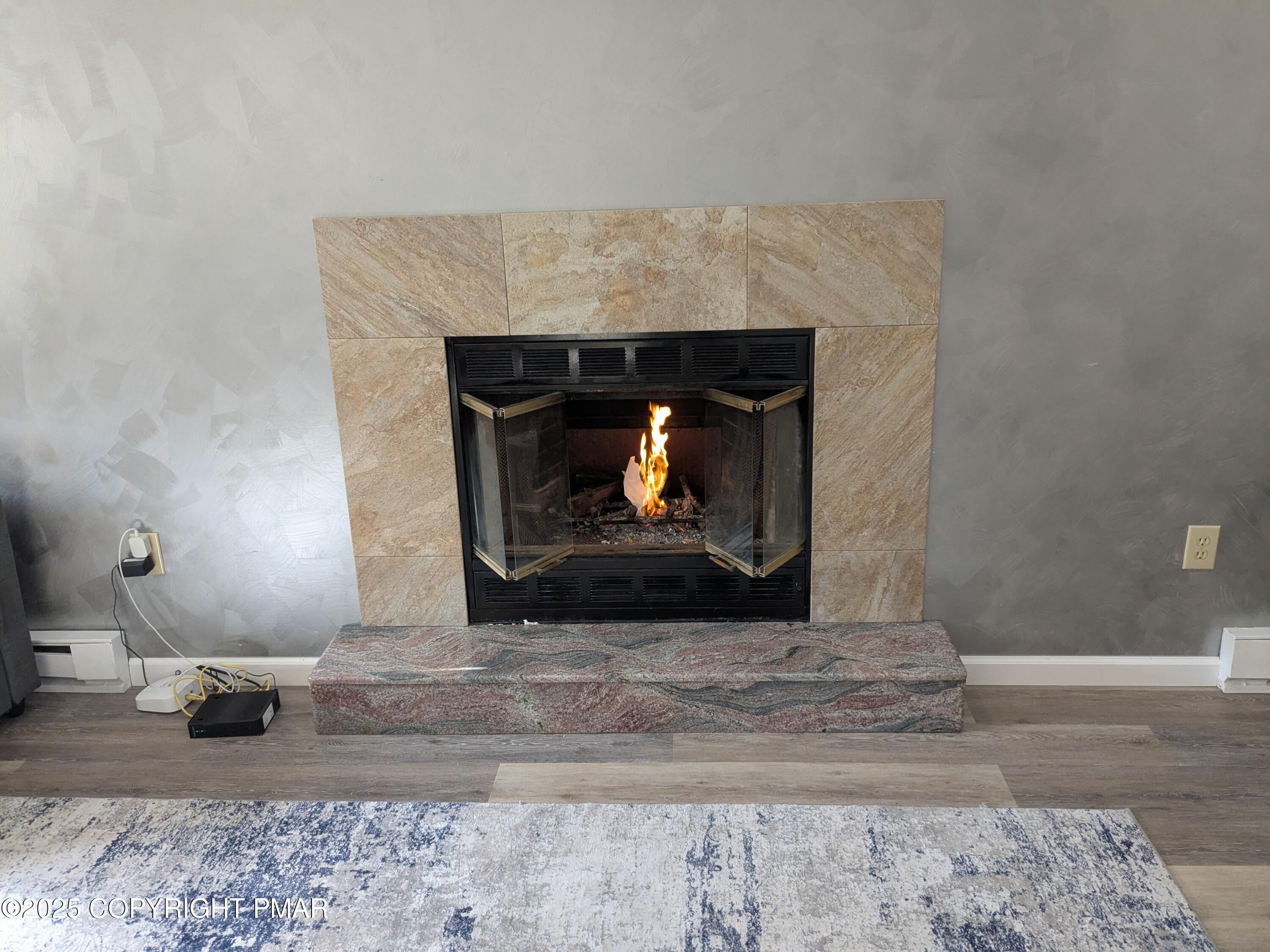 1027 Valley Road Newfoundland, PA 18445 - Photo 5 of 28 a living room with a fireplace