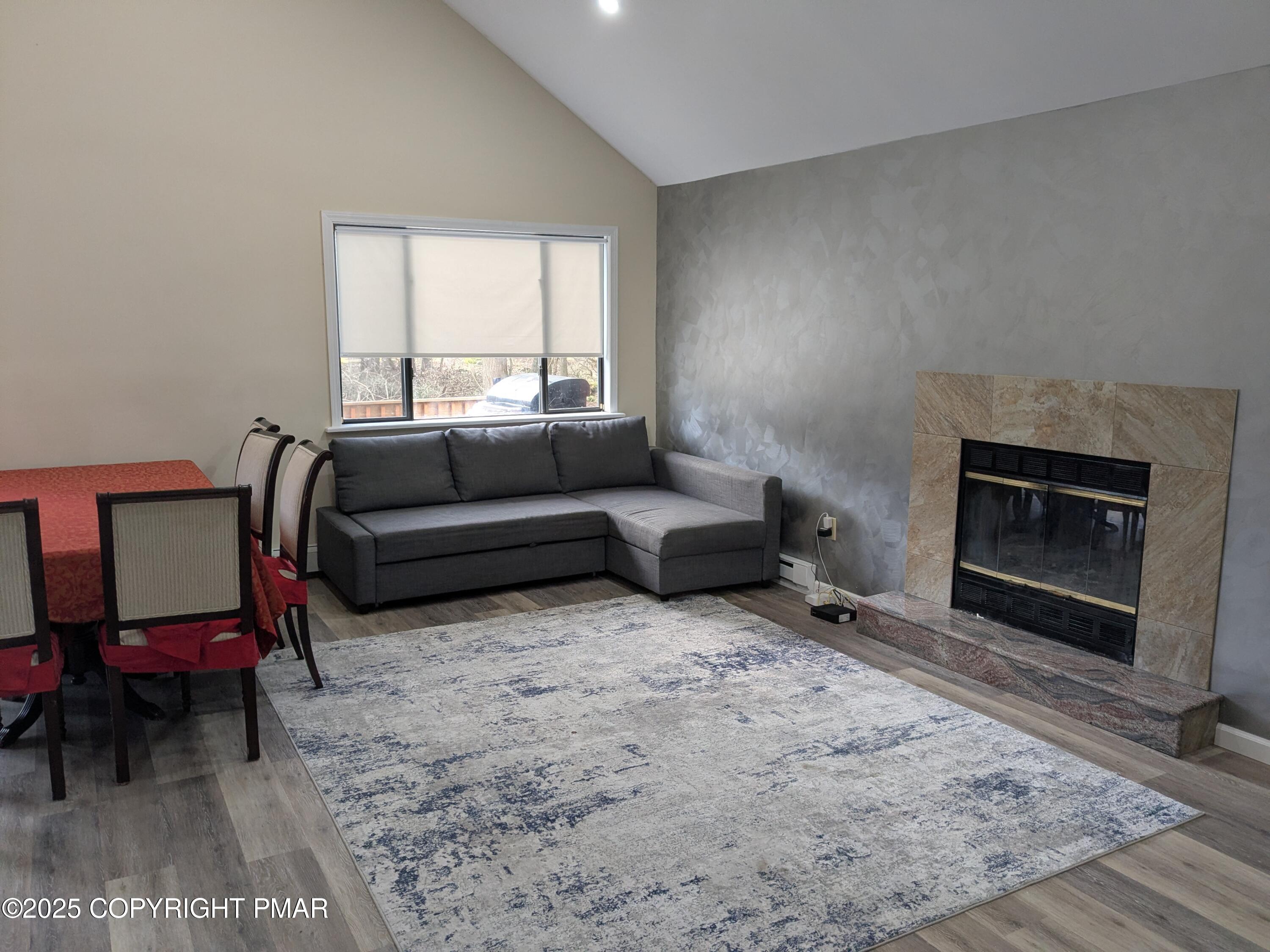 1027 Valley Road Newfoundland, PA 18445 - Photo 6 of 28 a living room with furniture window and a fireplace