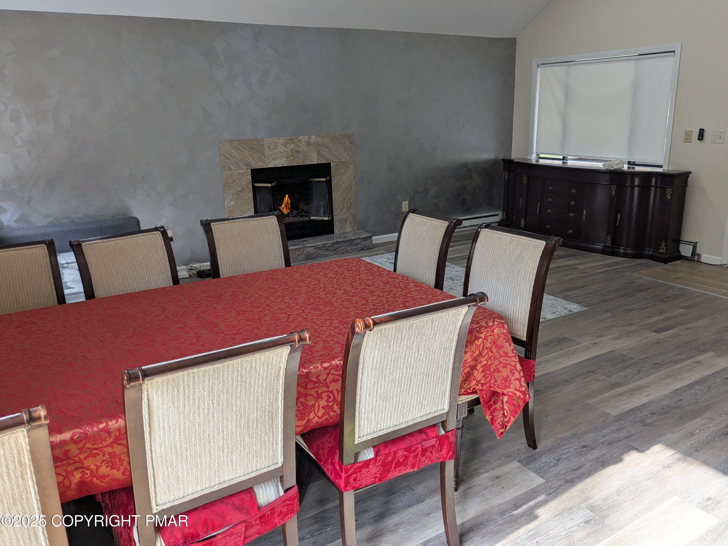 1027 Valley Road Newfoundland, PA 18445 - Photo 8 of 28 a bedroom with a bed a dresser and potted plants with wooden floor