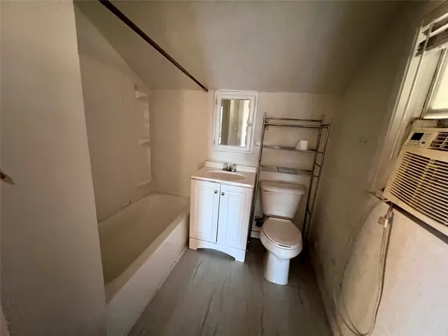a bathroom with a toilet and a sink