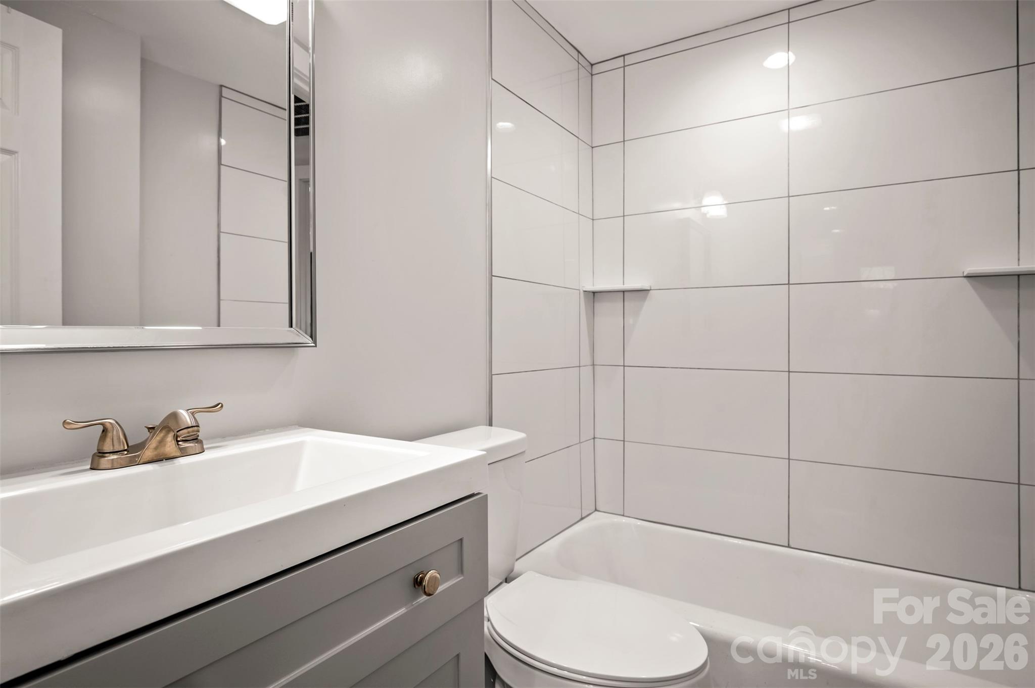 220 Roberson Road Forest City, NC 28043 - Photo 11 of 35 a bathroom with a sink toilet and shower