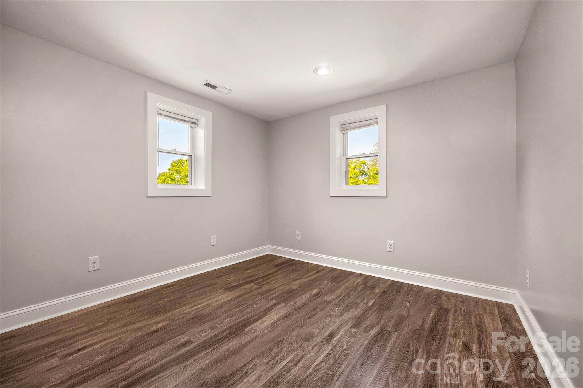 220 Roberson Road Forest City, NC 28043 - Photo 13 of 35 a view of an empty room with window and wooden floor