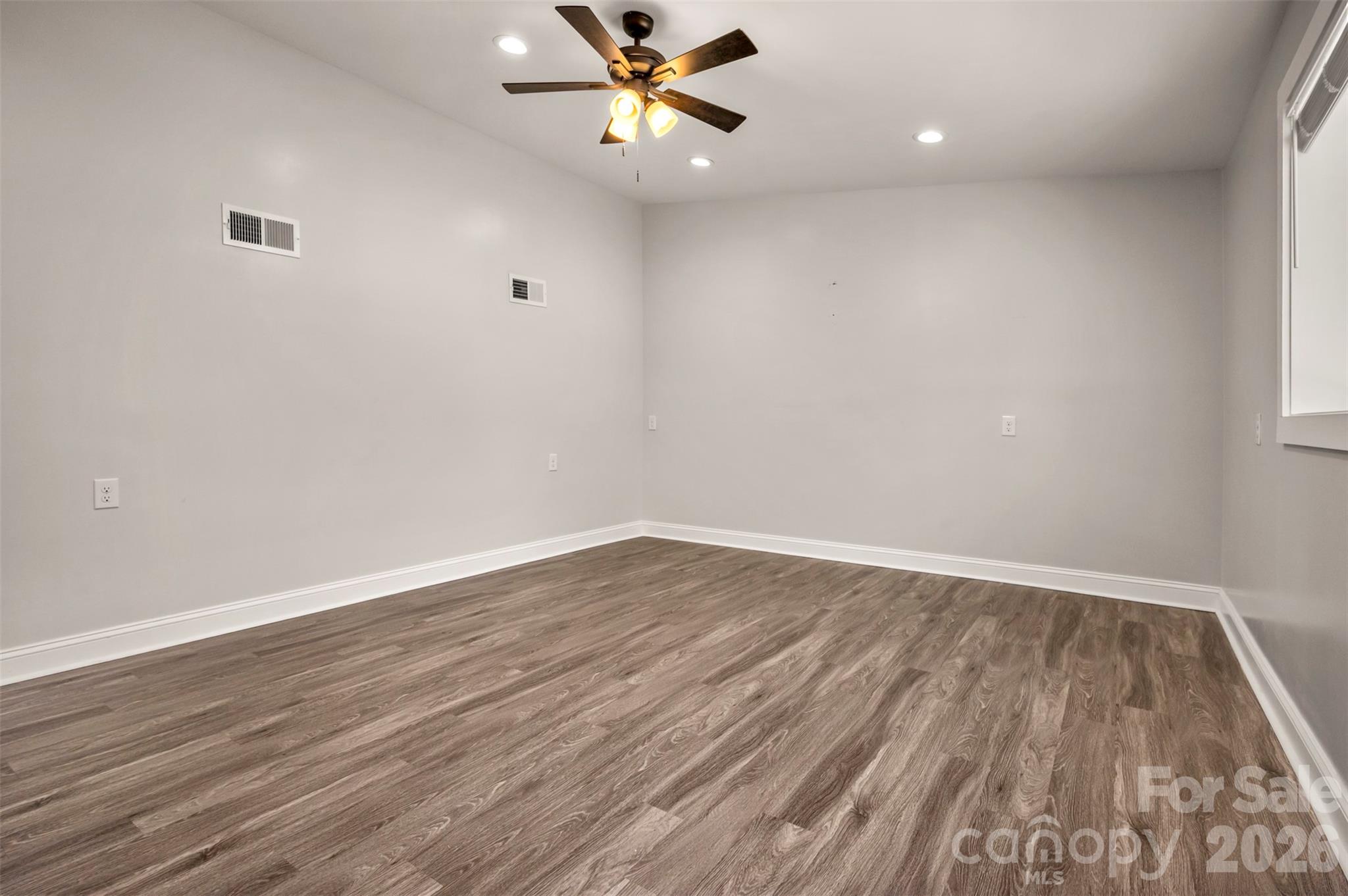 220 Roberson Road Forest City, NC 28043 - Photo 16 of 35 wooden floor in an empty room with a window