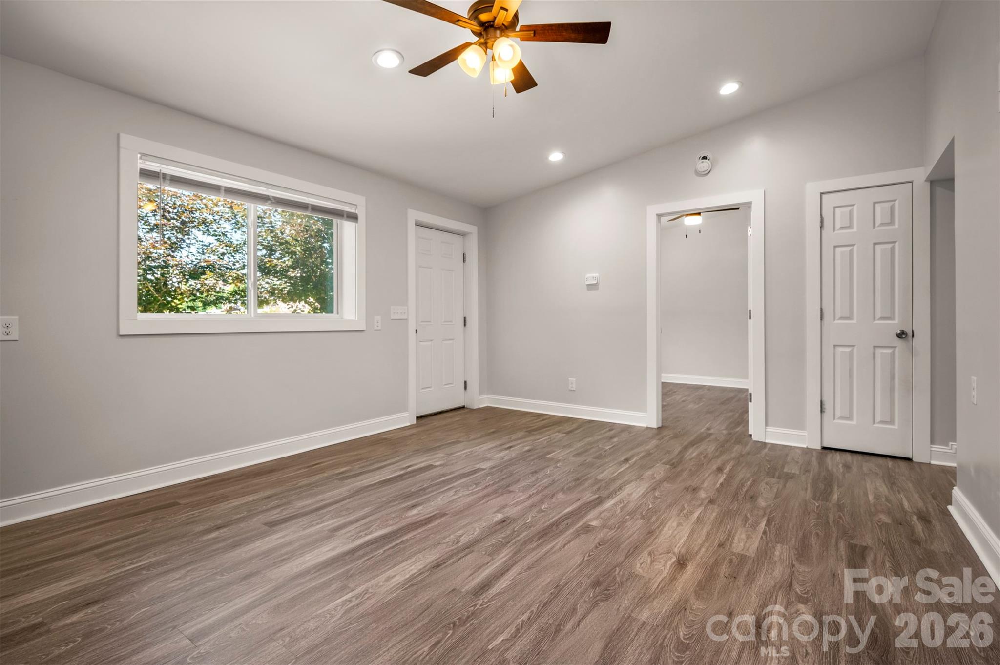 220 Roberson Road Forest City, NC 28043 - Photo 17 of 35 a view of an empty room with wooden floor and a window