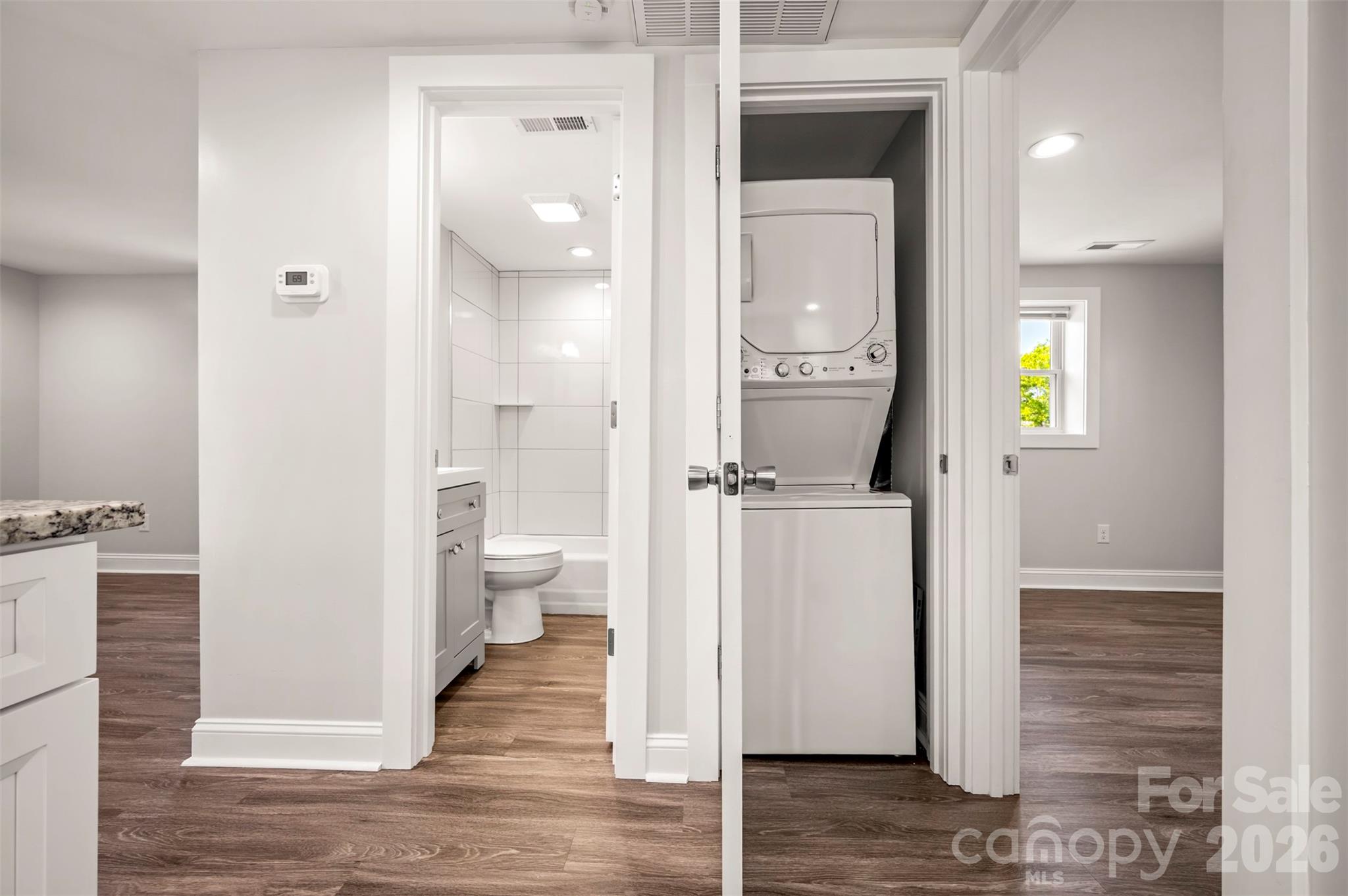 220 Roberson Road Forest City, NC 28043 - Photo 10 of 35 a view of a hallway with wooden floor and a bathroom