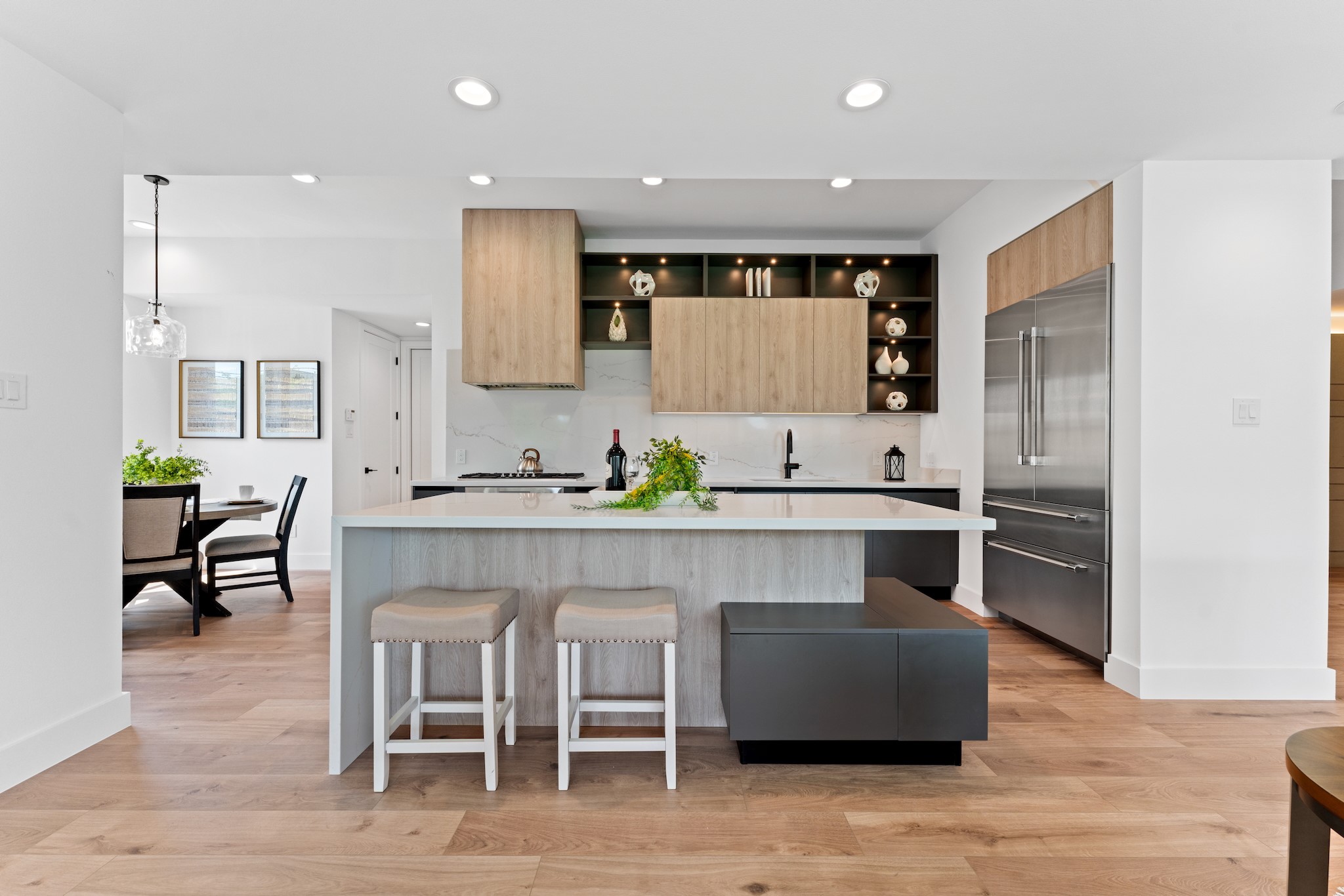 6711 Housman Houston, TX 77055 - Photo 11 of 49 a kitchen with stainless steel appliances granite countertop a table chairs sink and cabinets