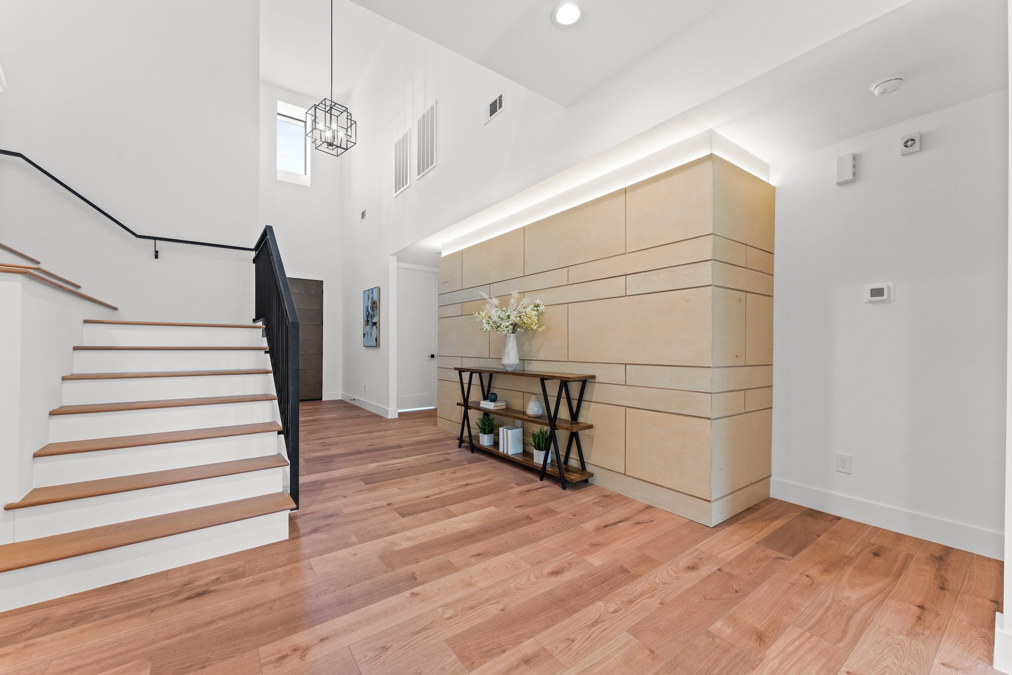 6711 Housman Houston, TX 77055 - Photo 19 of 49 a view of entryway and hall with wooden floor