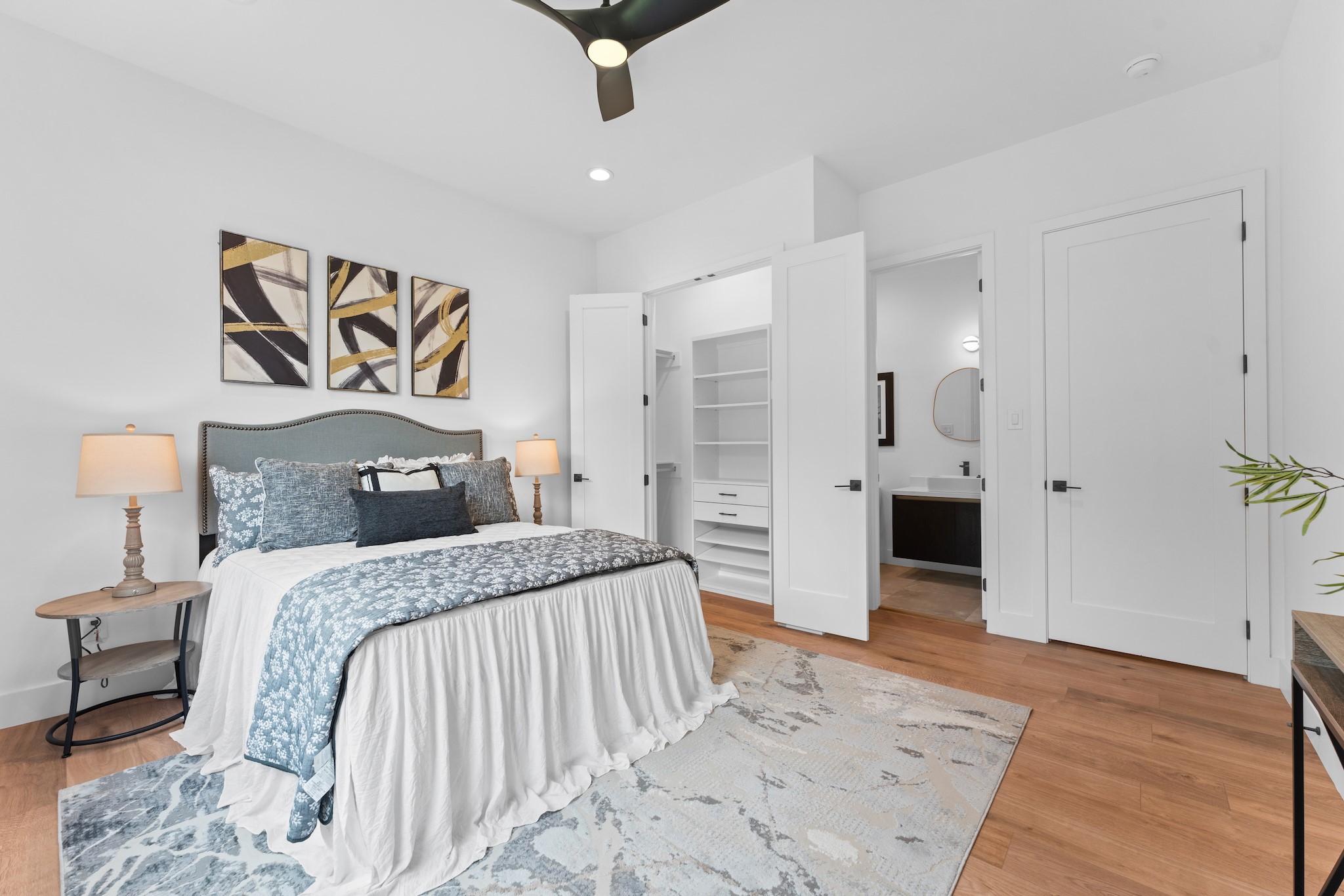 6711 Housman Houston, TX 77055 - Photo 31 of 49 a spacious bedroom with a bed and a table