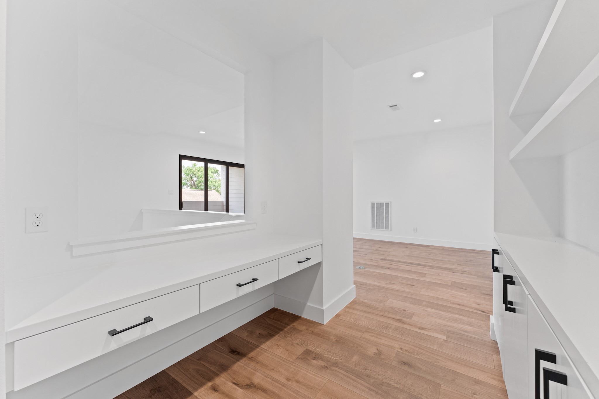 6711 Housman Houston, TX 77055 - Photo 38 of 49 a view of an empty room with wooden floor and a window