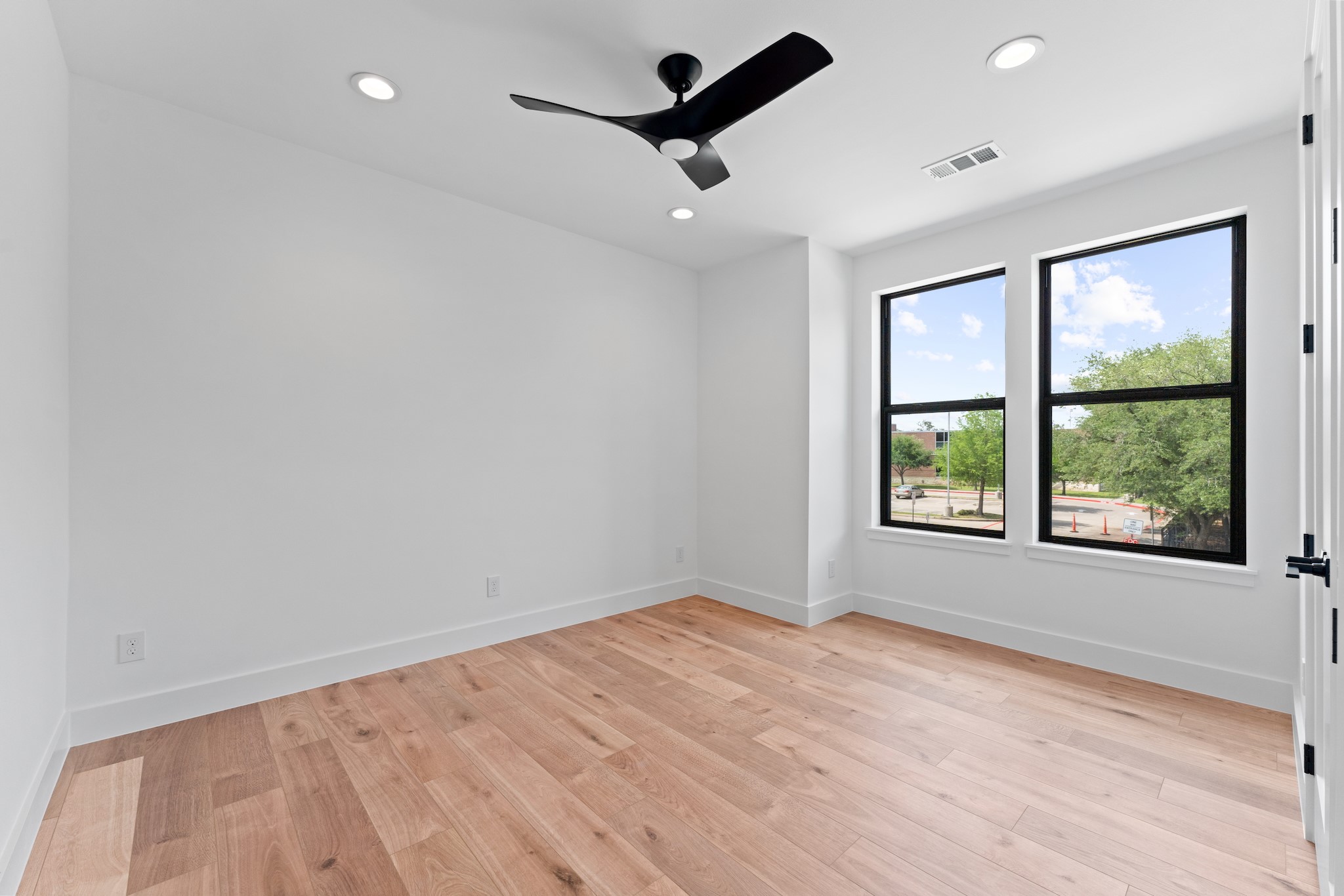 6711 Housman Houston, TX 77055 - Photo 48 of 49 wooden floor in an empty room with a window