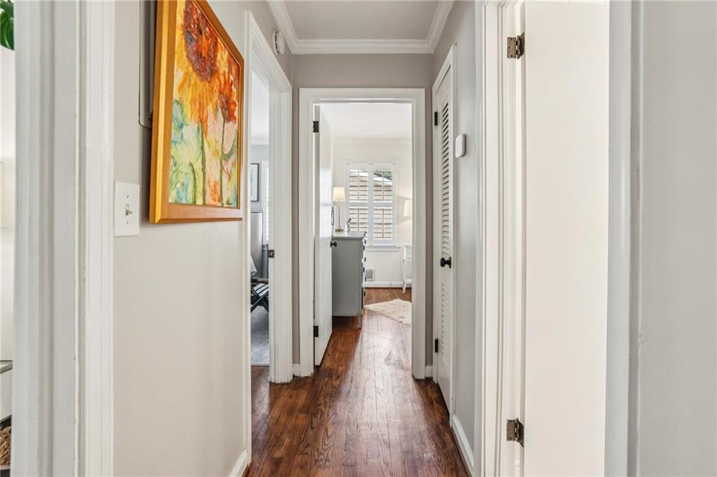 2226 Fairway Circle Northeast Brookhaven, GA 30319 - Photo 16 of 26 a view of a hallway with wooden floor and a bathroom