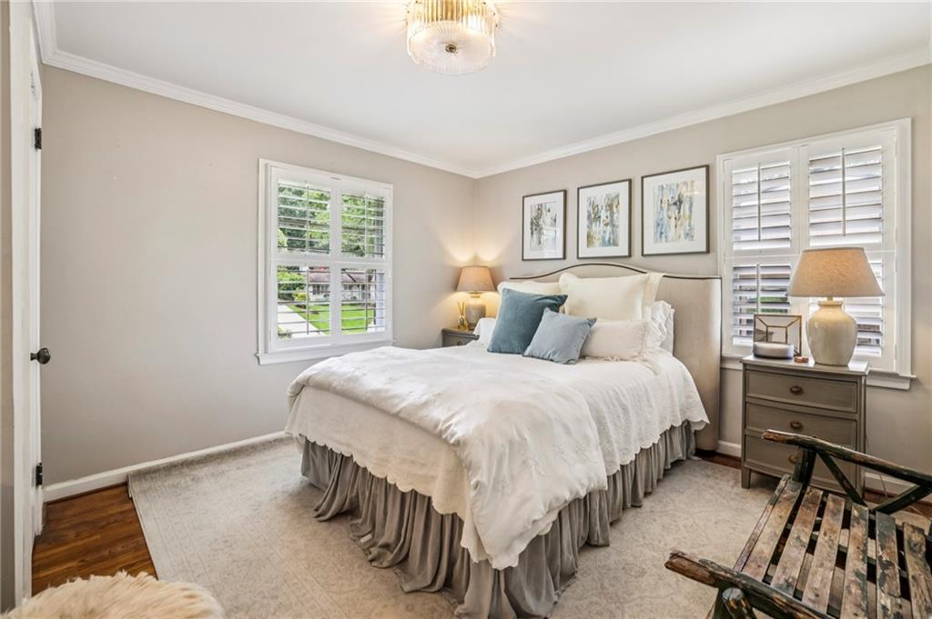 2226 Fairway Circle Northeast Brookhaven, GA 30319 - Photo 17 of 26 a bedroom with a bed and windows