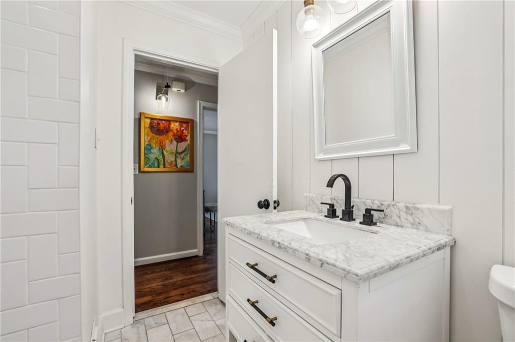 2226 Fairway Circle Northeast Brookhaven, GA 30319 - Photo 20 of 26 a bathroom with a granite countertop sink and a mirror