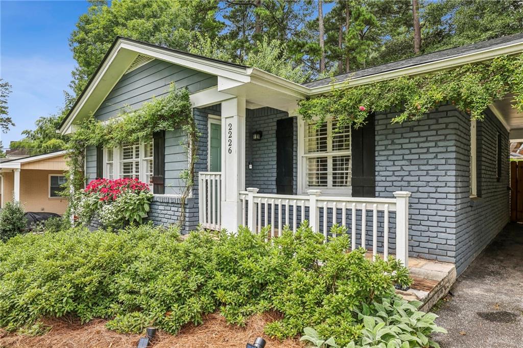 2226 Fairway Circle Northeast Brookhaven, GA 30319 - Photo 2 of 26 a view of a house that has a flower garden