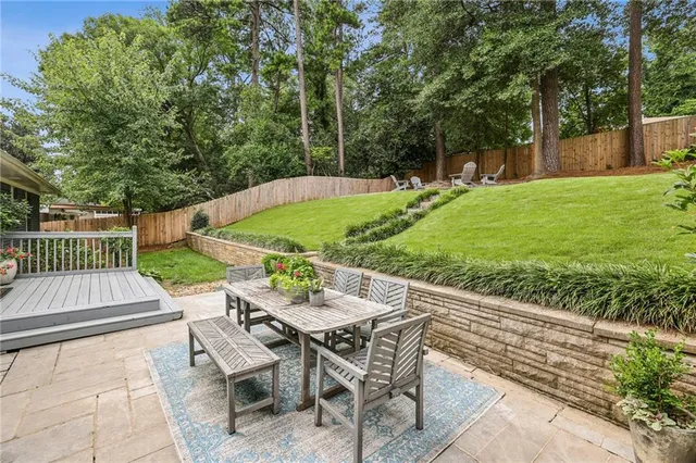 a view of a patio with a yard