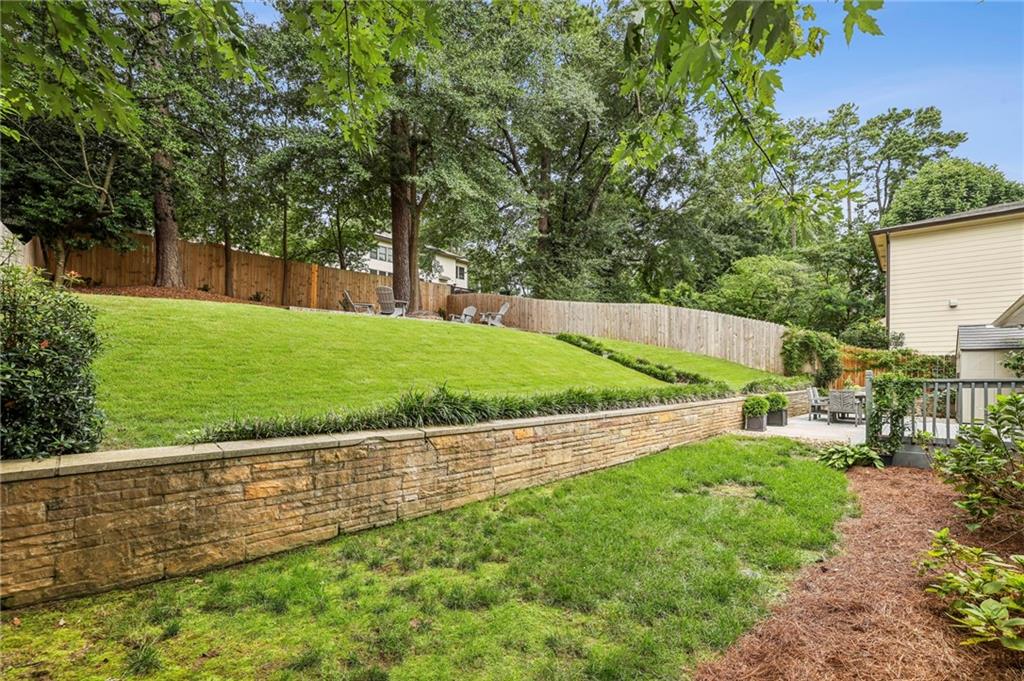 2226 Fairway Circle Northeast Brookhaven, GA 30319 - Photo 22 of 26 a view of a backyard with large trees