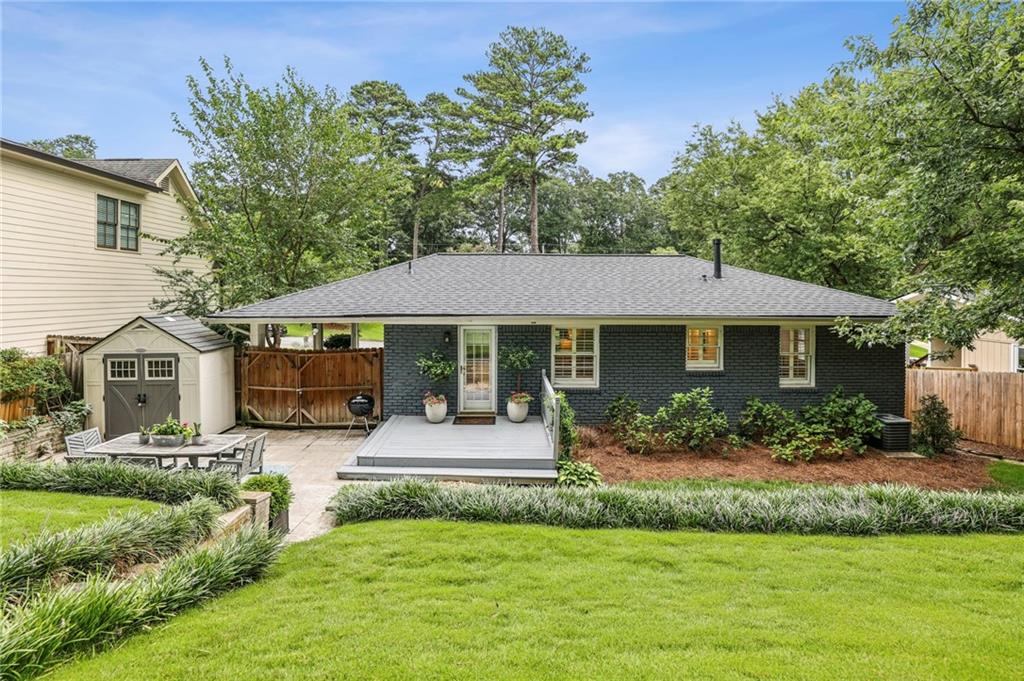 2226 Fairway Circle Northeast Brookhaven, GA 30319 - Photo 25 of 26 a front view of a house with a yard