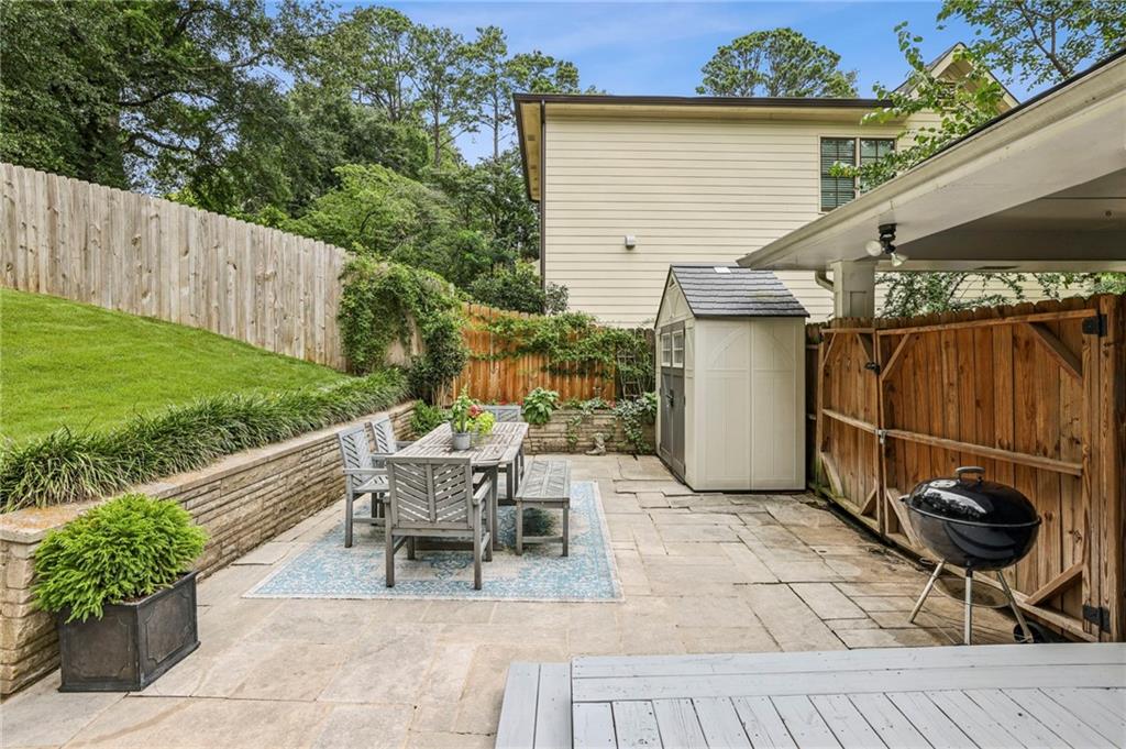 2226 Fairway Circle Northeast Brookhaven, GA 30319 - Photo 26 of 26 a view of a patio with a table and chairs