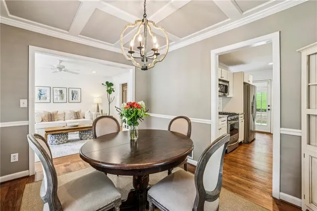 a dining room with furniture a livingroom and chandelier