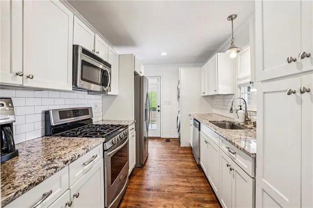 a large kitchen with a stove top oven