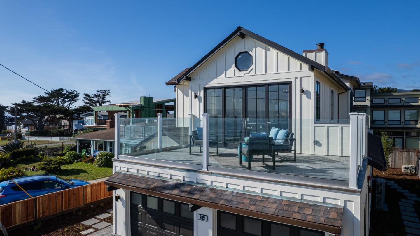 989 Ocean Boulevard Moss Beach, CA 94038 - Photo 13 of 44 a front view of a house with a porch