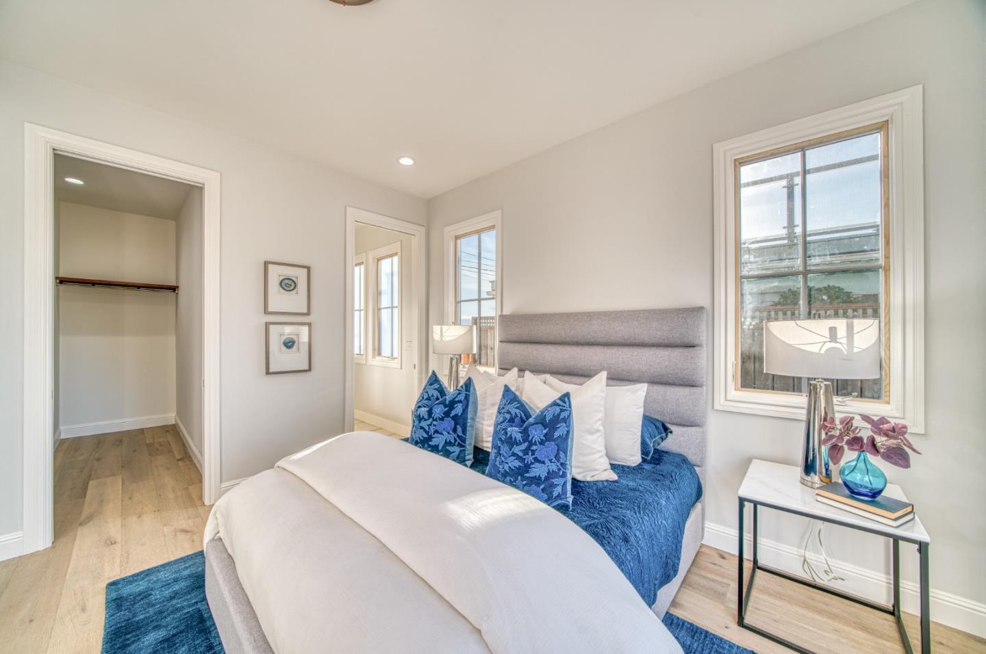 989 Ocean Boulevard Moss Beach, CA 94038 - Photo 32 of 44 a bedroom with furniture and a window