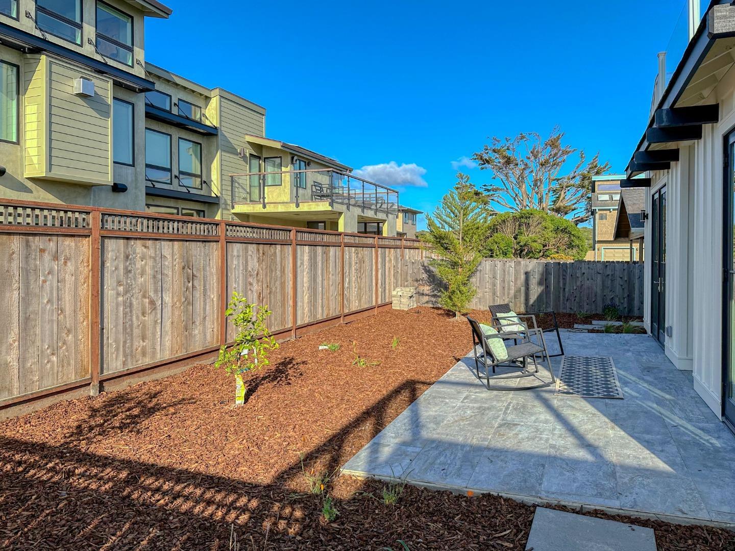 989 Ocean Boulevard Moss Beach, CA 94038 - Photo 38 of 44 a view of a backyard with sitting area and furniture