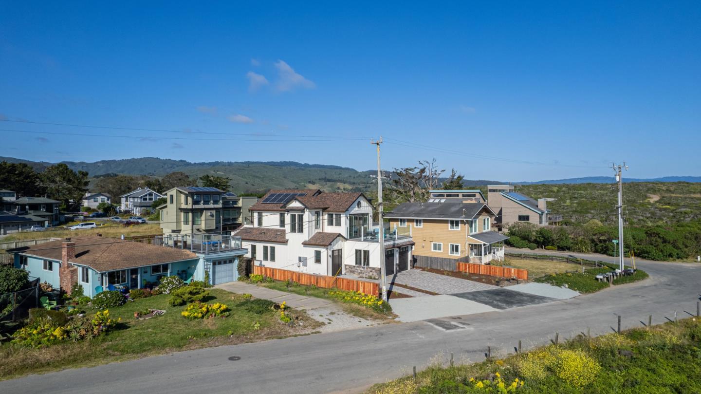 989 Ocean Boulevard Moss Beach, CA 94038 - Photo 41 of 44 an aerial view of residential houses with outdoor space and trees