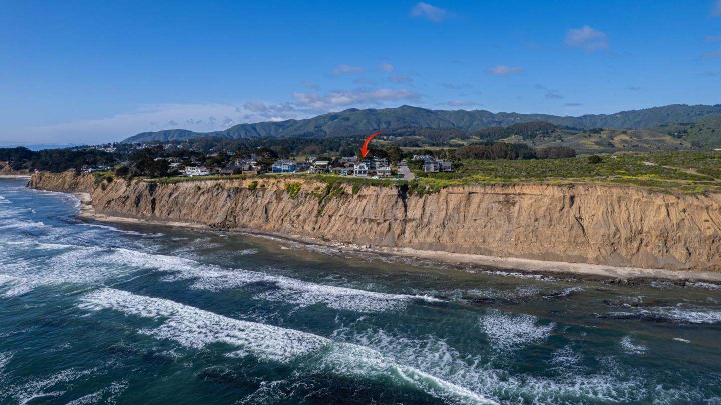 989 Ocean Boulevard Moss Beach, CA 94038 - Photo 43 of 44 a view of a lake with mountains in the background