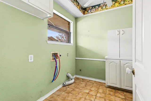 a view of a porch with furniture and garden