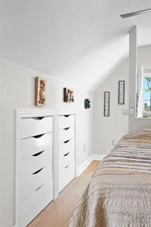 a bedroom with a bed and a closet