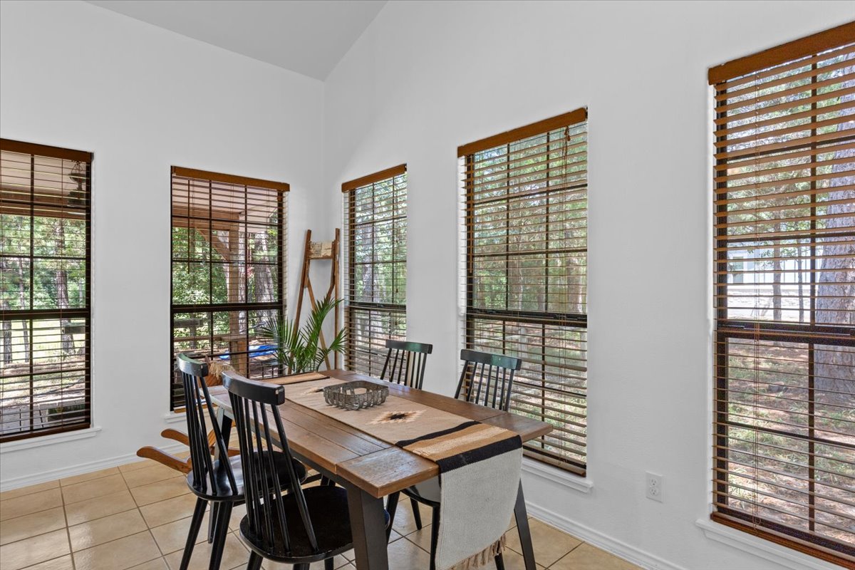 120 Lake Point Way Bastrop, TX 78602 - Photo 11 of 40 a view of a dining room with furniture window and outside view