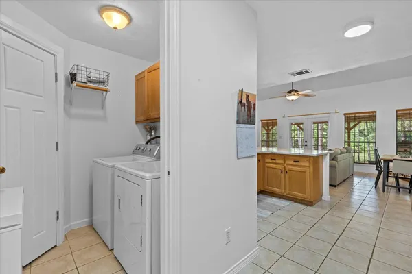 a kitchen with a sink counter top space appliances and cabinets