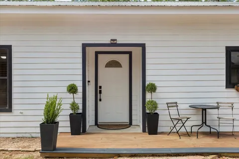 a front view of a house with seating