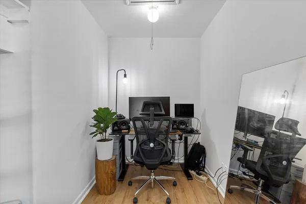 a bedroom with bed couch and window