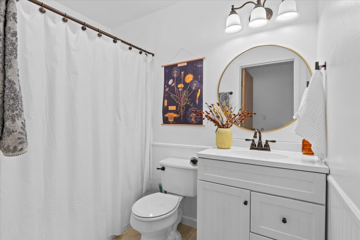 120 Lake Point Way Bastrop, TX 78602 - Photo 25 of 40 a bathroom with a toilet sink and mirror