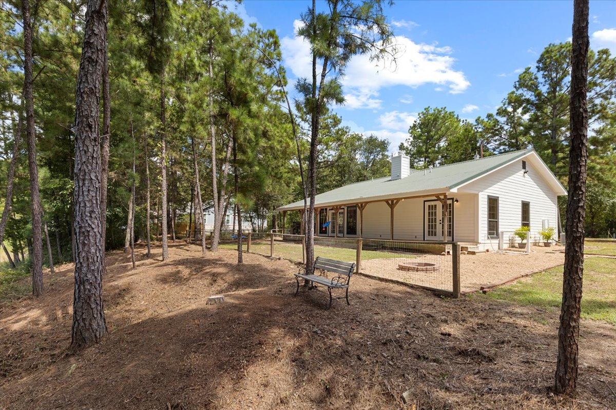 120 Lake Point Way Bastrop, TX 78602 - Photo 35 of 40 a view of a house with backyard and a tree