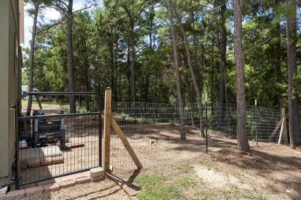 a backyard of a house with a tree