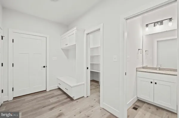 a kitchen with a sink cabinets and a window