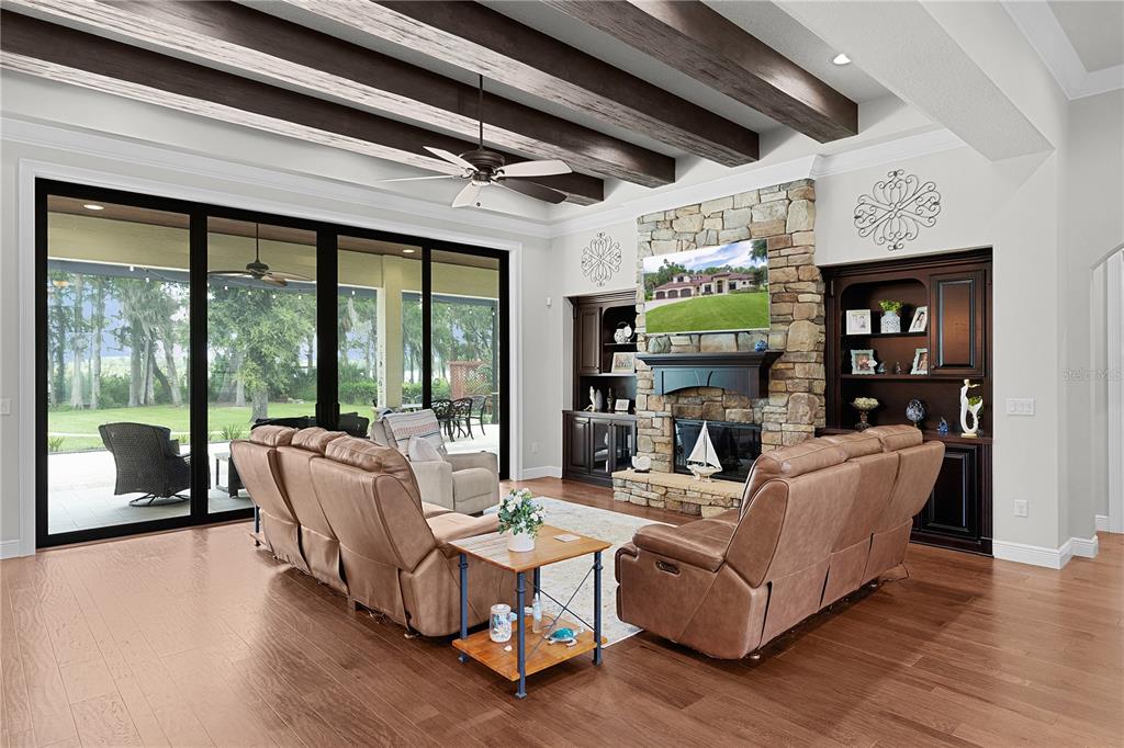 10994 North River Ranch Path Crystal River, FL 34428 - Photo 11 of 58 a living room with fireplace furniture and a wooden floor