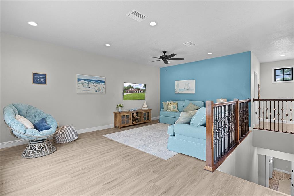 10994 North River Ranch Path Crystal River, FL 34428 - Photo 31 of 58 a living room with furniture and a wooden floor