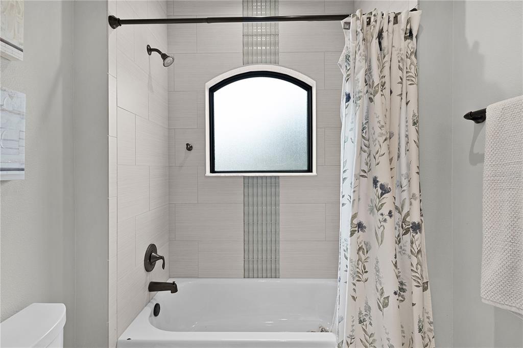 10994 North River Ranch Path Crystal River, FL 34428 - Photo 32 of 58 a bathroom with a sink a toilet and a bathtub