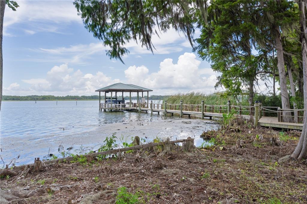 10994 North River Ranch Path Crystal River, FL 34428 - Photo 48 of 58 a view of a yard with table and chairs