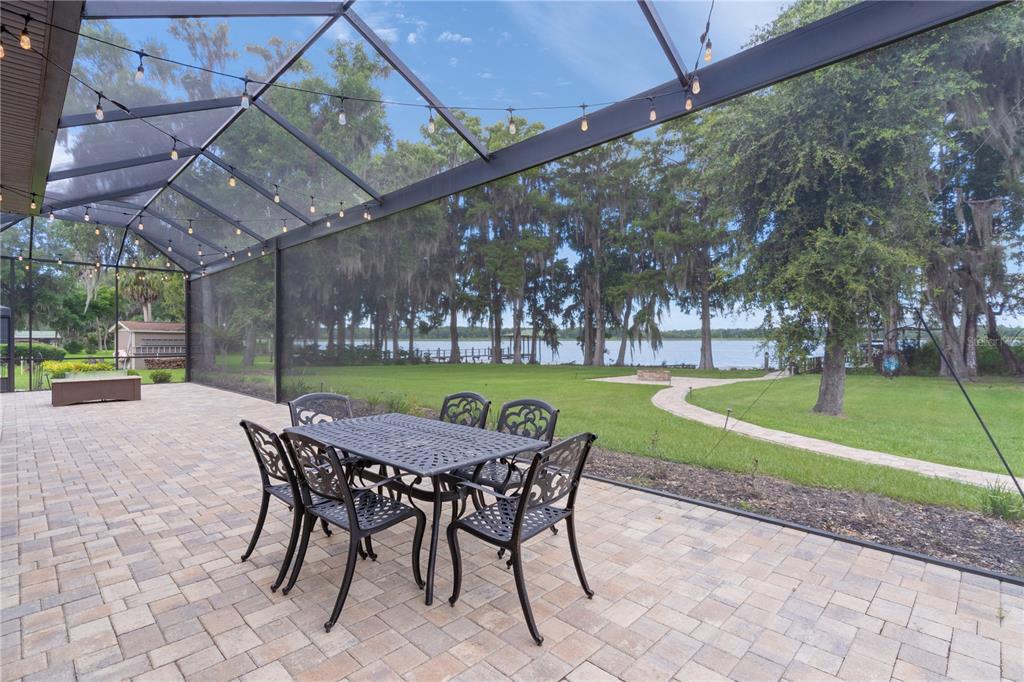 10994 North River Ranch Path Crystal River, FL 34428 - Photo 50 of 58 a patio with a yard table and chairs