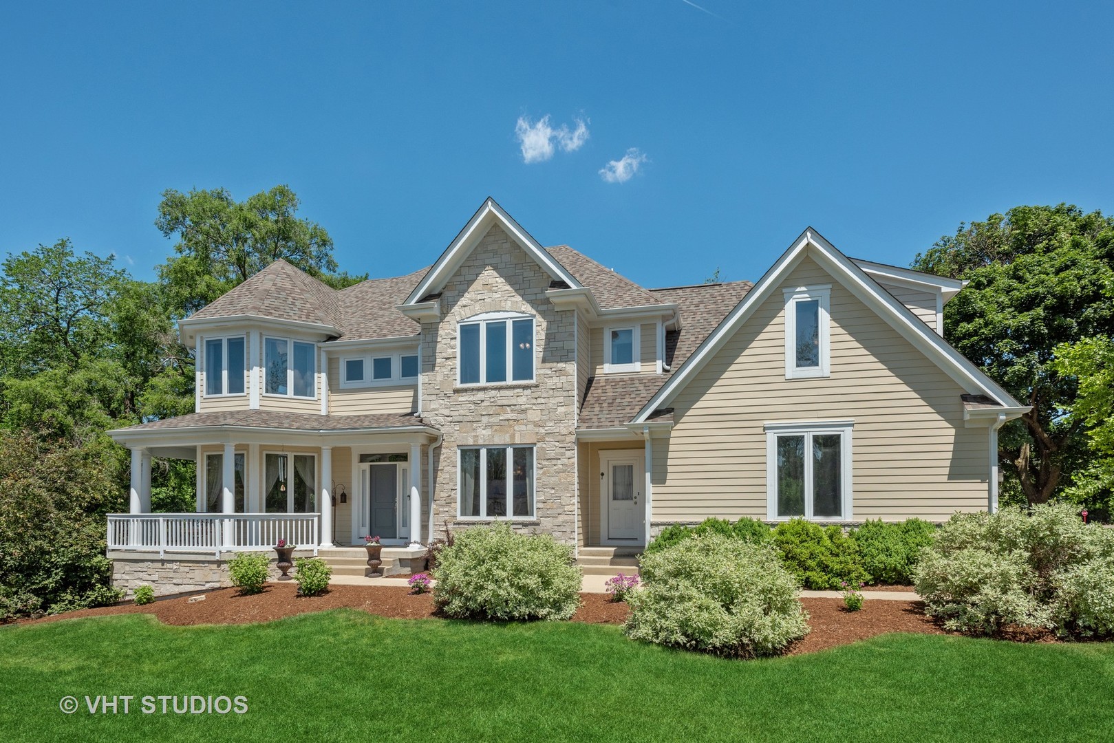 N210 Silverleaf Boulevard Wheaton, IL 60187 - Photo 2 of 48 a front view of a house with a yard